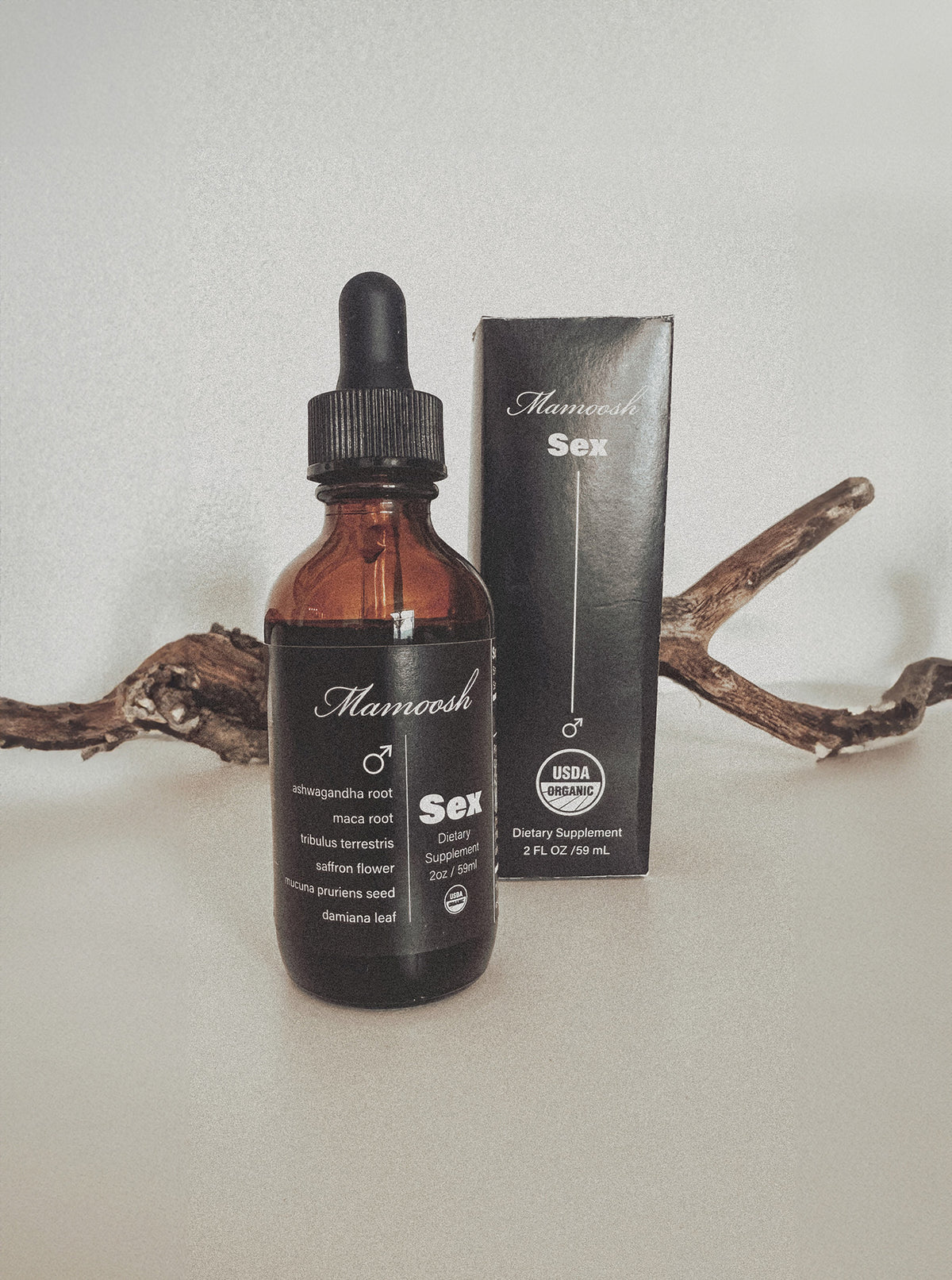 Bottle and packaging of the Mamoosh black edition sex tincture.